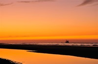 Avondlicht op strand van 